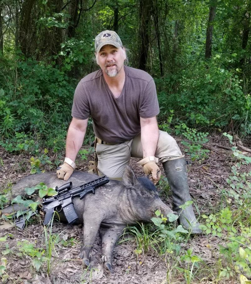 Hunter with Harvested Wild Boar - Oklahoma Hunt Trips in OK